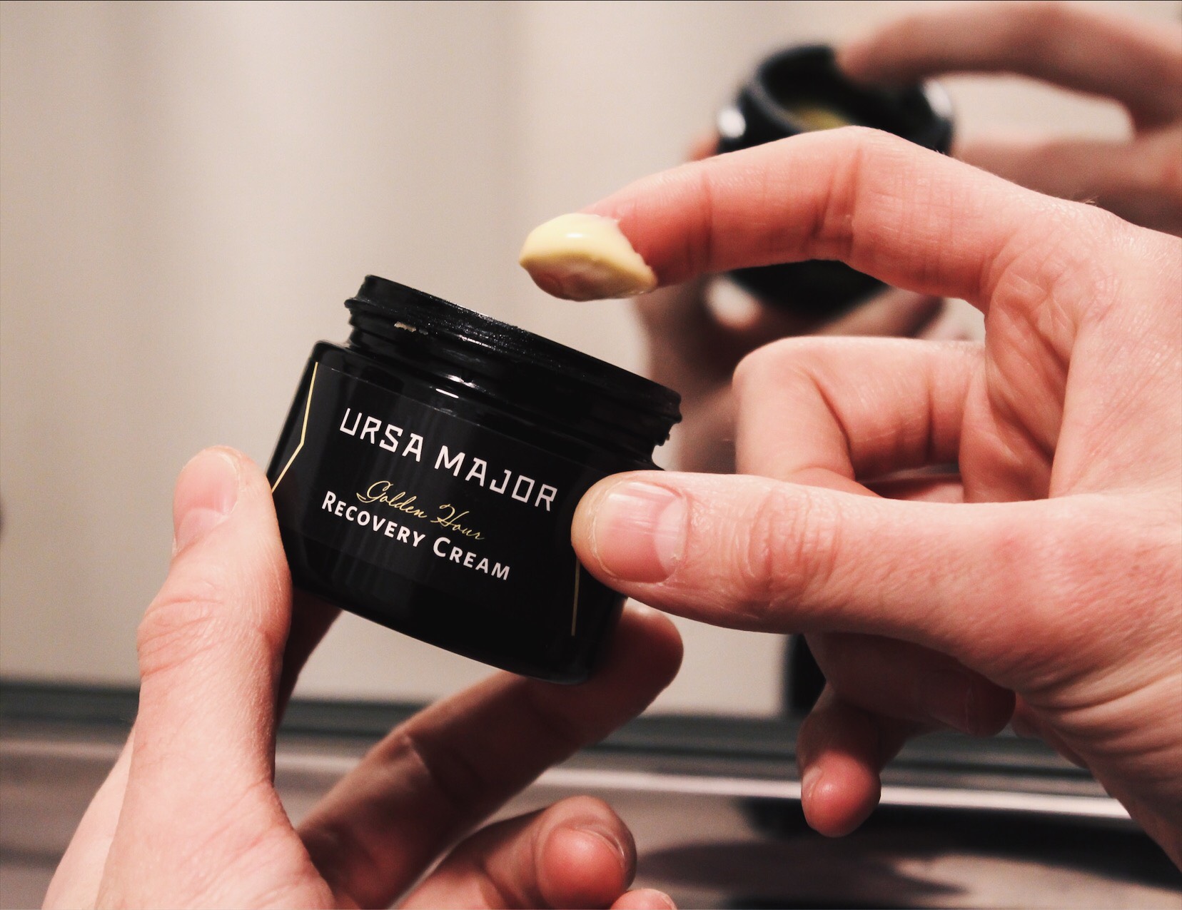 dipping finger in ursa major cream