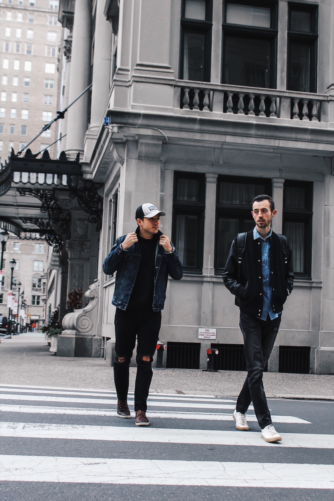 alex and mike crossing street in center city