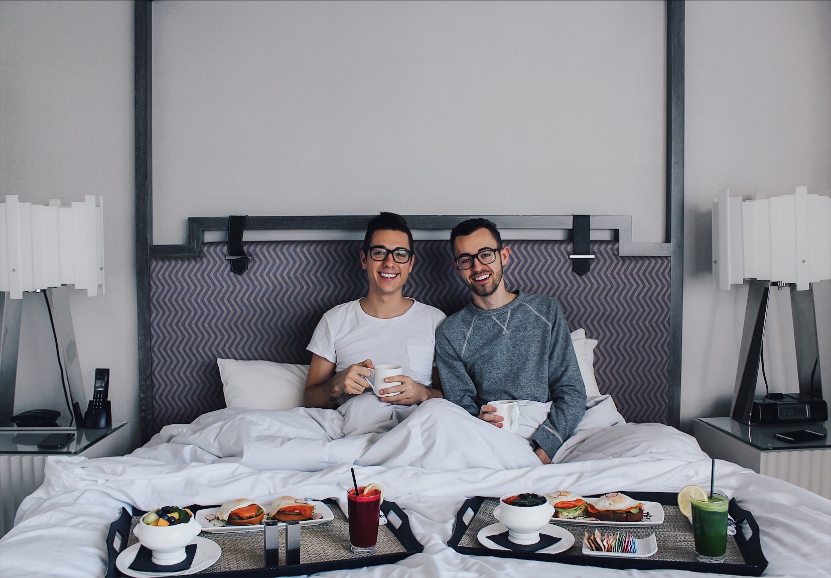 alex and mike breakfast in bed during staycation